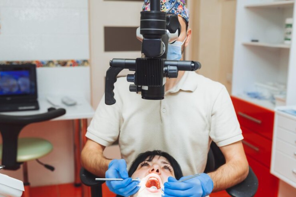 dentist performing bone grafting treatment using advanced technology